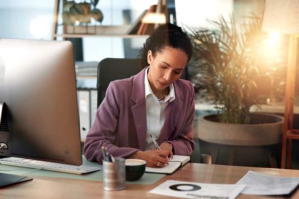 Computer, planning and writing with business woman