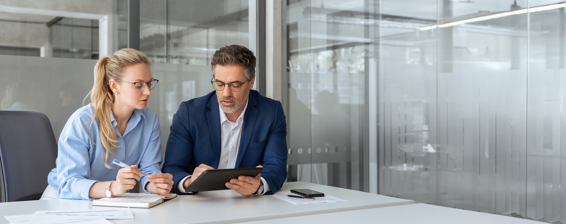 Project Manager consulting with team member over action items